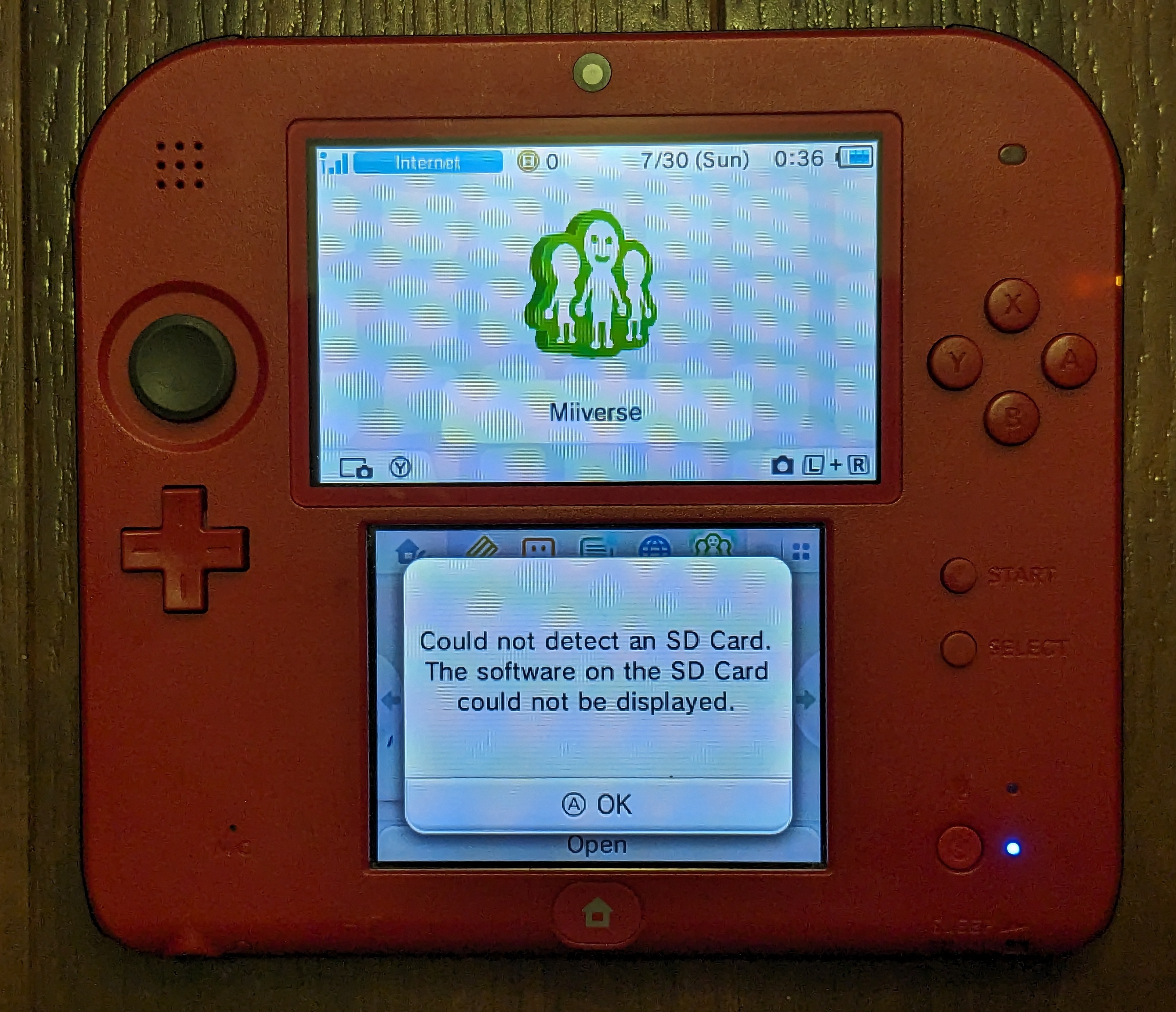 The home screen on my Nintendo 2DS, with some Miiverse thing on the top and the following error message on the bottom: &ldquo;Could not detect an SD Card. The software on the SD Card could not be displayed.&rdquo;